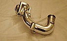 AFTER PHOTO OF TOYOTA SUPRA WATER NECK AFTER CUSTOM CUTTING SERVICES, RE-SURFACING, WELDING AND POLISHING SERVICES TO A MIRROR FINISH!