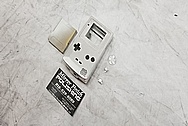 Nintendo Gameboy Aluminum Cover BEFORE Chrome-Like Metal Polishing and Buffing Services / Restoration Services - Aluminum Polishing 