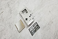 Nintendo Gameboy Aluminum Cover BEFORE Chrome-Like Metal Polishing and Buffing Services / Restoration Services - Aluminum Polishing 