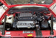 1994 Oldsmobile Cutlass Engine Compartment BEFORE Chrome-Like Metal Polishing and Buffing Services / Restoration Services - Aluminum and Steel Polishing Services