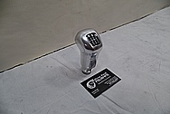 2009 Aston Martin DBS Aluminum and Glass Shifter Knob BEFORE Chrome-Like Metal Polishing and Buffing Services - Aluminum Polishing Services 