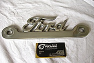 Aluminum Ford Trim Emblem BEFORE Chrome-Like Metal Polishing and Buffing Services