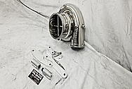 On 3 Performance Aluminum Turbo Housing BEFORE Chrome-Like Metal Polishing and Buffing Services - Aluminum Polishing