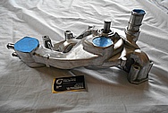 Aluminum Engine Waterpump BEFORE Chrome-Like Metal Polishing and Buffing Services - Aluminum Polishing 