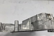 Aluminum Engine Timing Cover BEFORE Chrome-Like Metal Polishing and Buffing Services | Aluminum Polishing